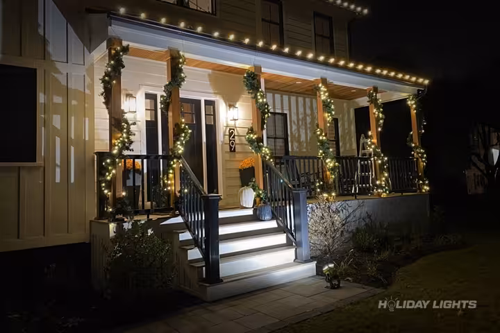 Professional residential christmas light installation in Manchester, New Hampshire — Porch Garland Decorations